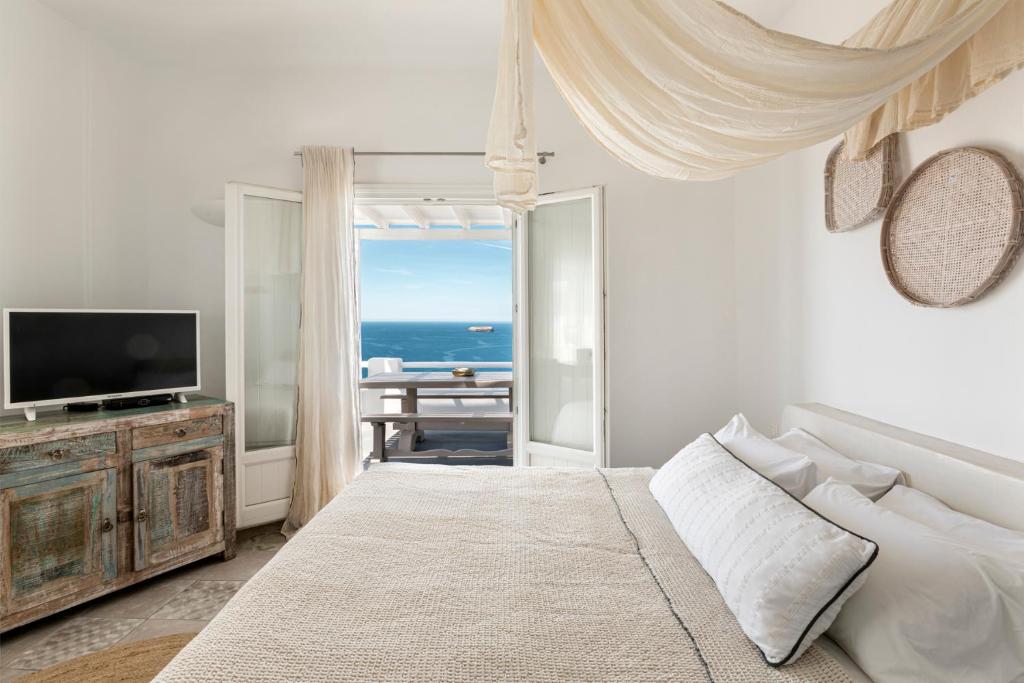TV a/nebo společenská místnost v ubytování Grand View - Megalochori Santorini