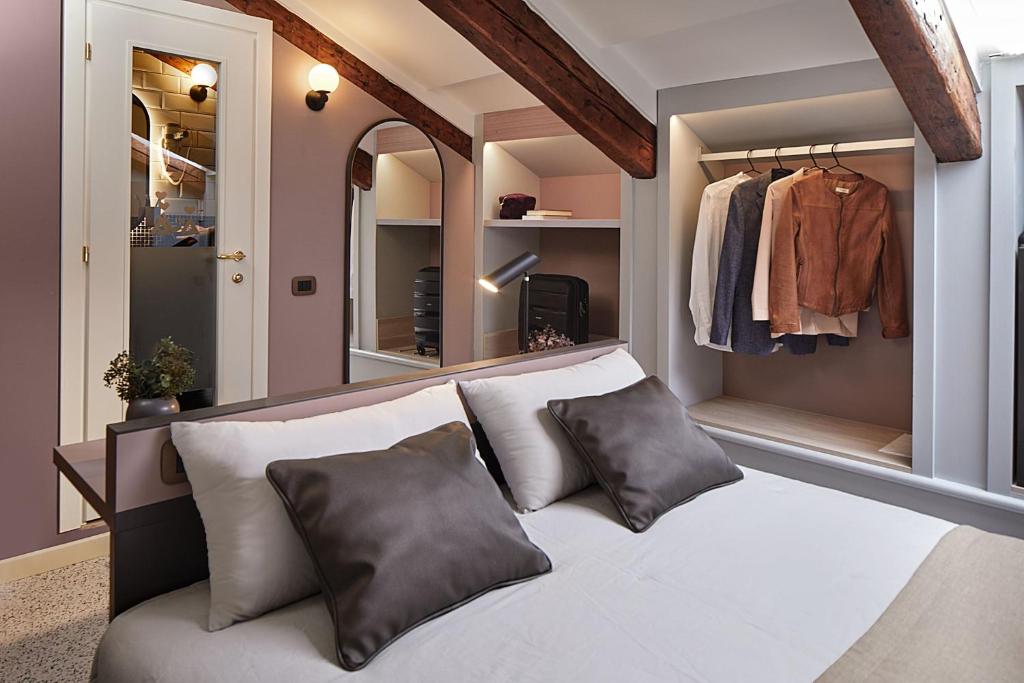 Postel nebo postele na pokoji v ubytování UNAHOTELS Ala Venezia-Adults 16