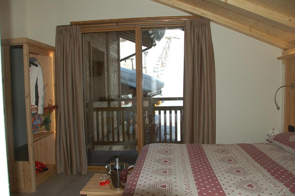 Postel nebo postele na pokoji v ubytování Hotel Carpe Diem
