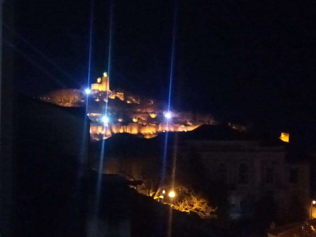 a view of a city at night with lights at Mercury Guest House in Veliko Tŭrnovo