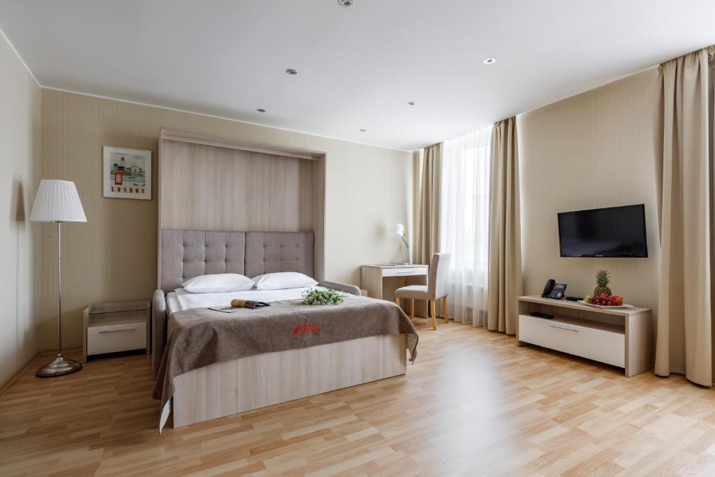 Ein Bett oder Betten in einem Zimmer der Unterkunft Vertical Aparthotel