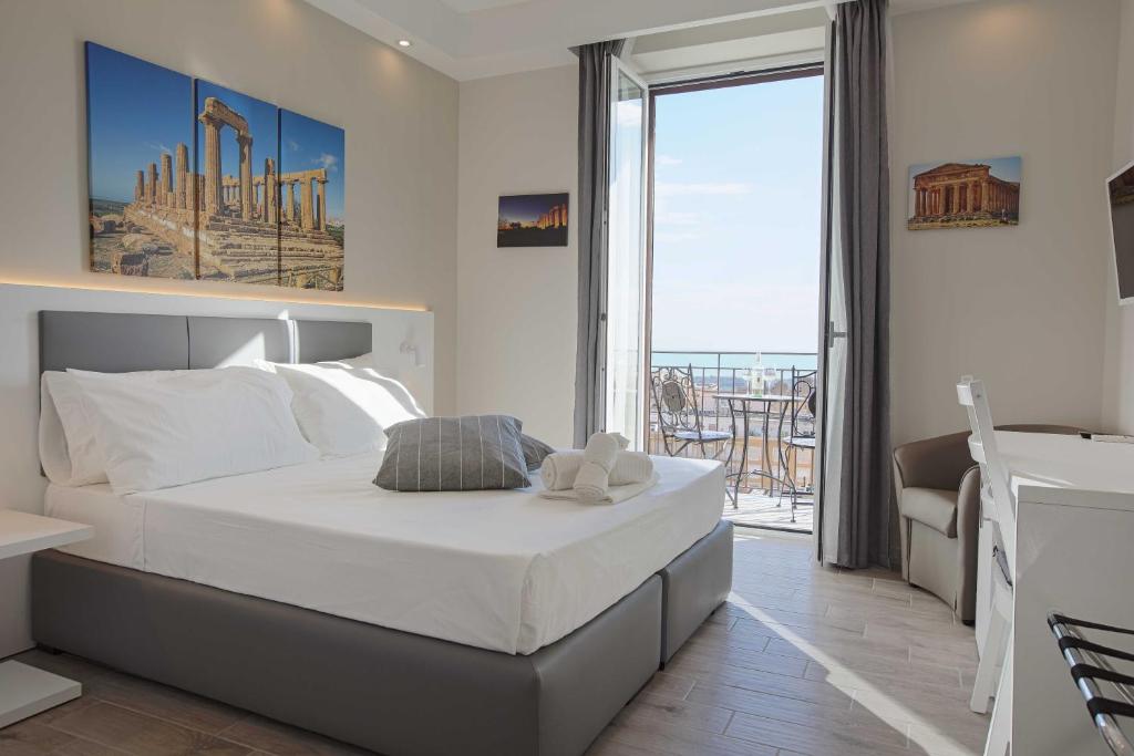 Postel nebo postele na pokoji v ubytování Esseneto Rooms