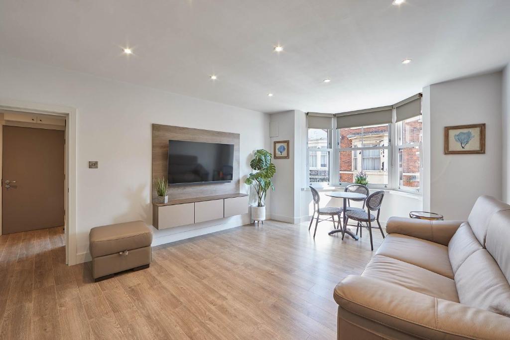 a living room with a couch and a table at Host & Stay - The Merchants Quarters in Scarborough