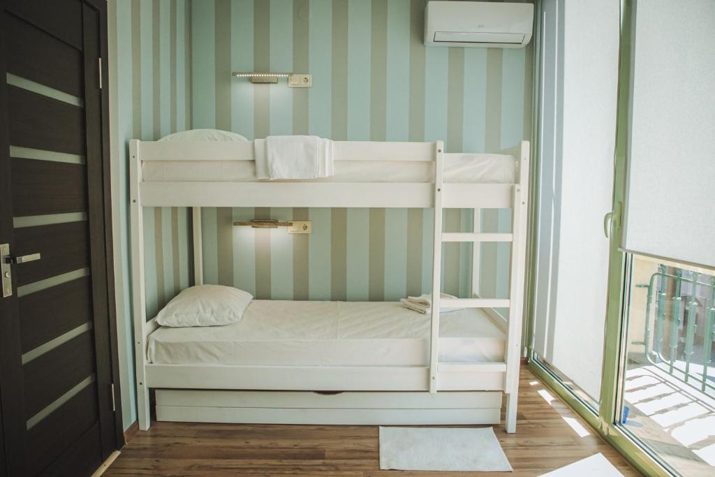 Postel nebo postele na pokoji v ubytování Alina Hotel & Hostel