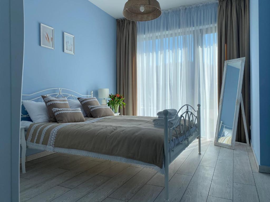 Posteľ alebo postele v izbe v ubytovaní Apartament Krzysztofa Bochusa