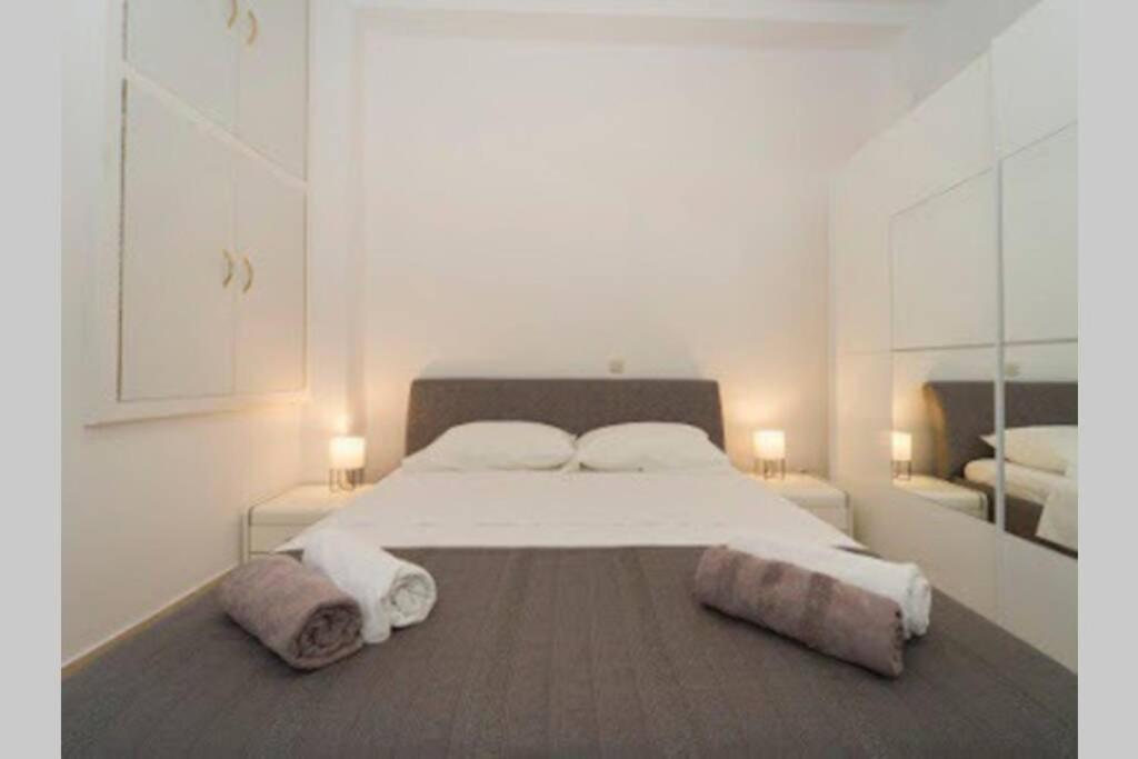 Posteľ alebo postele v izbe v ubytovaní Apartment N central