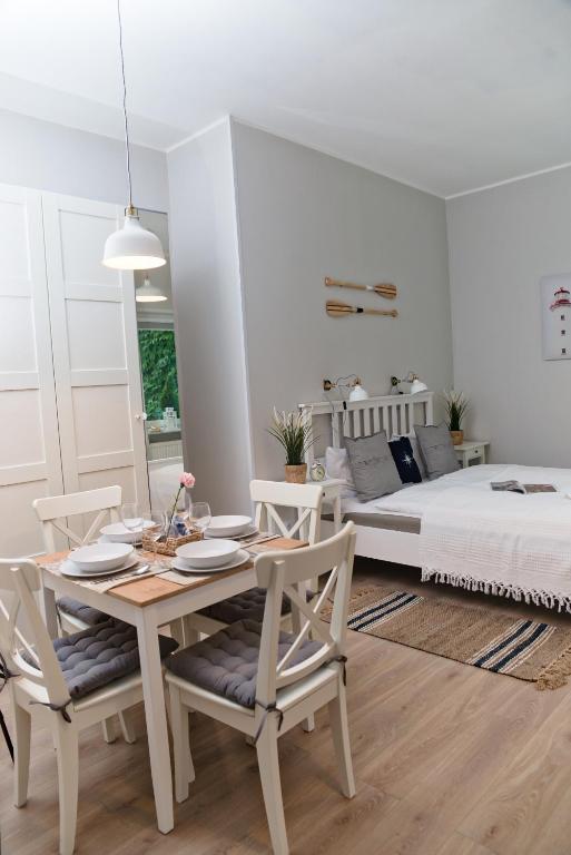 Postel nebo postele na pokoji v ubytování Portofino Seaside Apartments