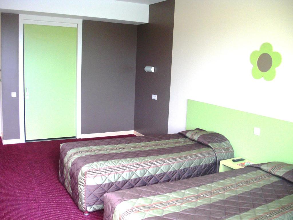 Postel nebo postele na pokoji v ubytování Fasthotel Orléans Nord Artenay