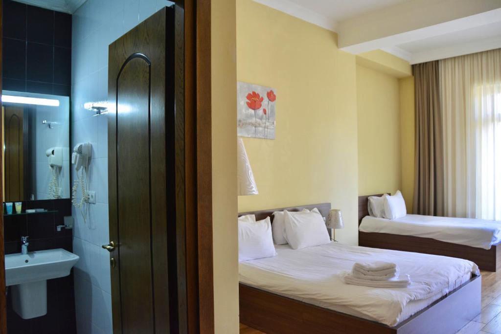 Rúm í herbergi á Boutique Hotel O. Galogre