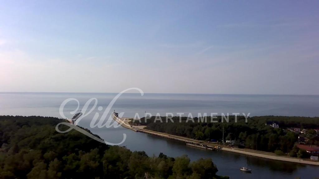 an aerial view of a bridge over a body of water at Lilu Apartamenty in Dziwnów