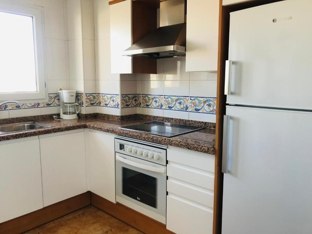 Kuchyň nebo kuchyňský kout v ubytování EDIFICIO OASIS