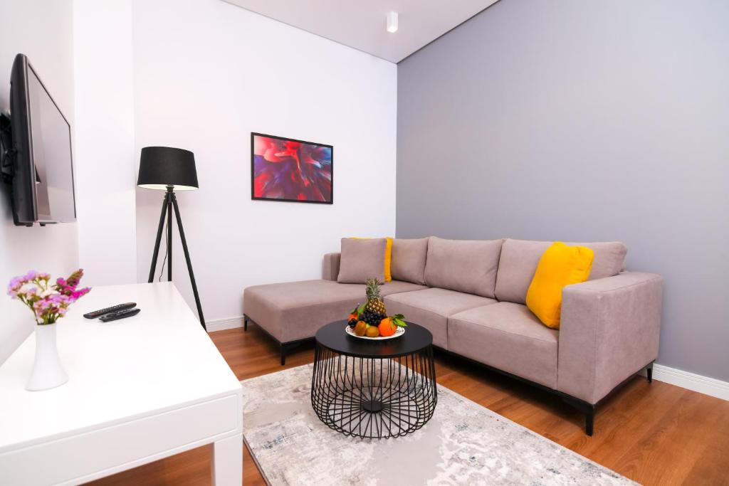 a living room with a couch and a table at N Hotel BY NOSHI in Rinas