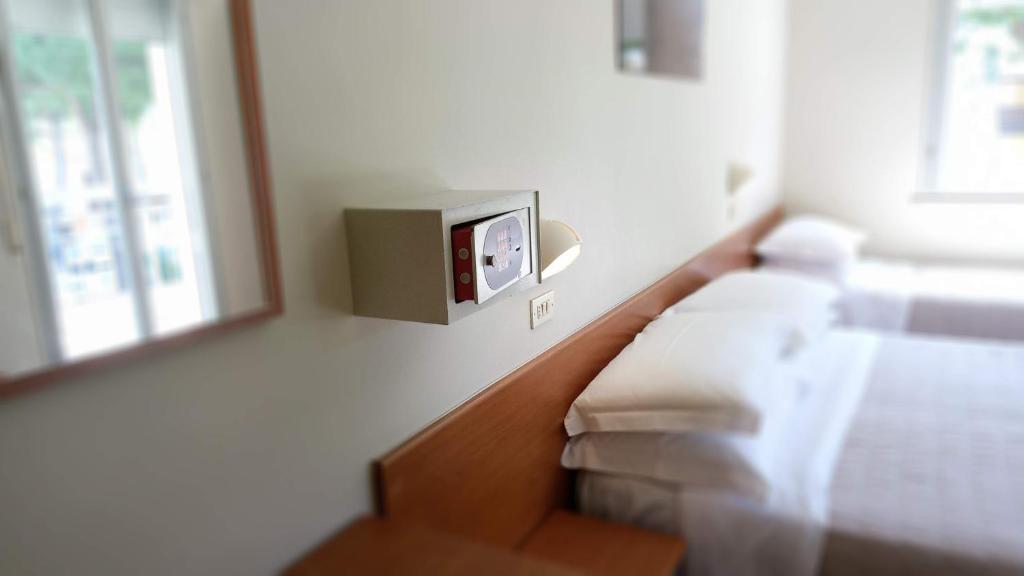 Postel nebo postele na pokoji v ubytování Hotel President