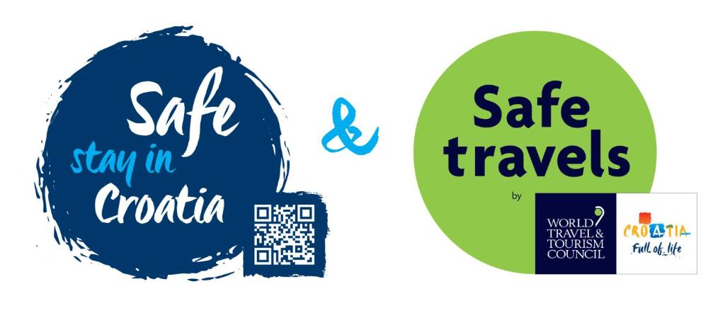 two stickers with the text safe travels and stay in croatia and world travel at Apartments Stasic in Vrbnik