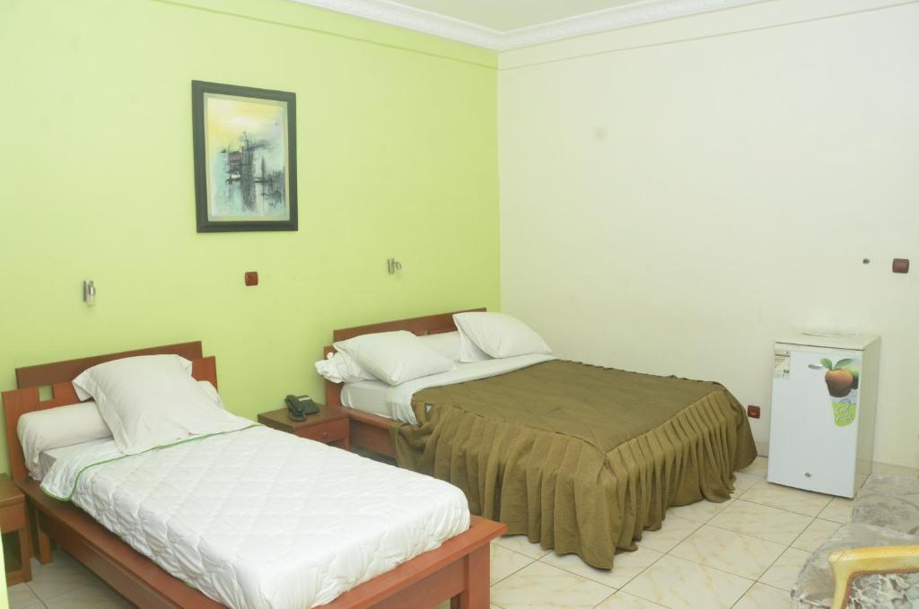 Postel nebo postele na pokoji v ubytování Hotel - Y