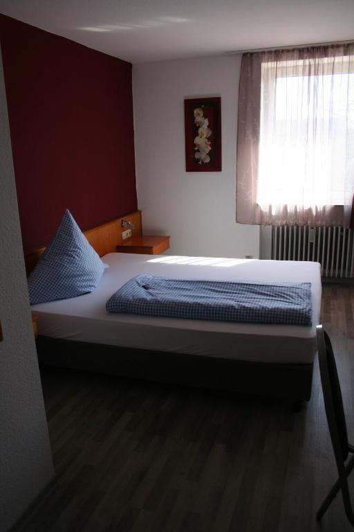 Postel nebo postele na pokoji v ubytování Gasthof Berg