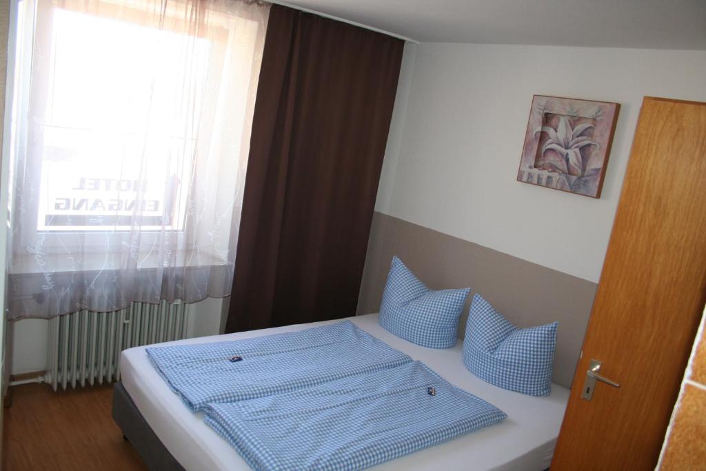 Postel nebo postele na pokoji v ubytování Gasthof Berg