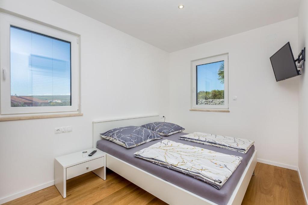 Posteľ alebo postele v izbe v ubytovaní Apartment JOY