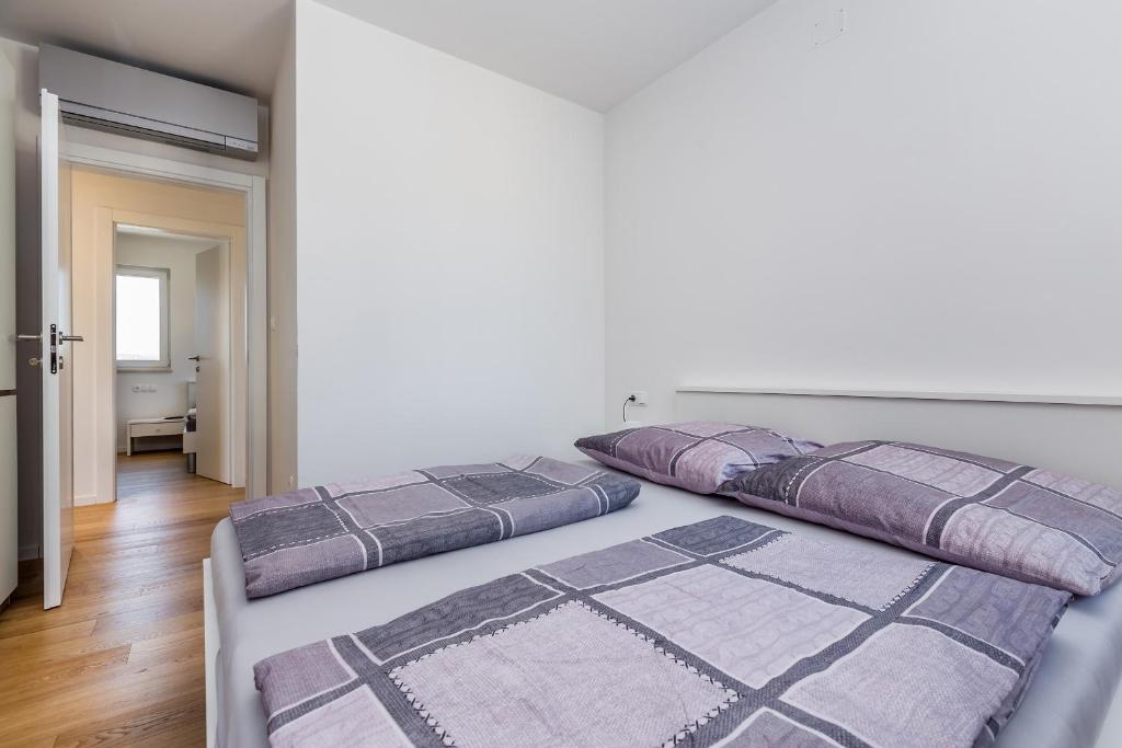 Posteľ alebo postele v izbe v ubytovaní Apartment JOY