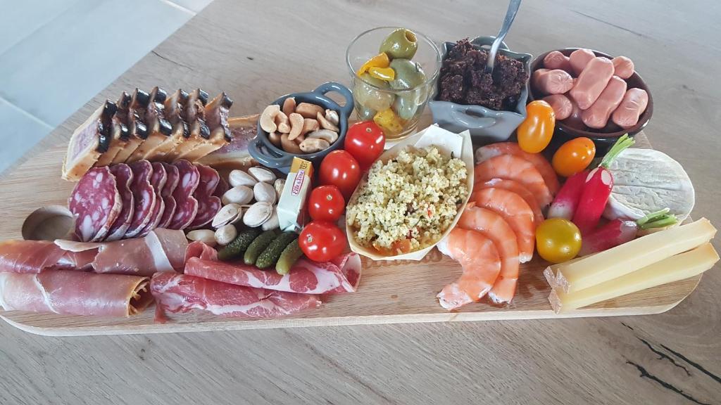 a tray of different types of food on a table at gite A L' ÉVIDENCE in Mornas