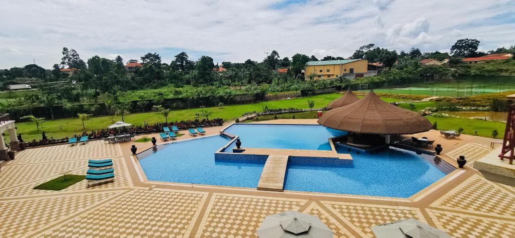 an overhead view of a large swimming pool in a park at Kampala Nile Resort in Seeta