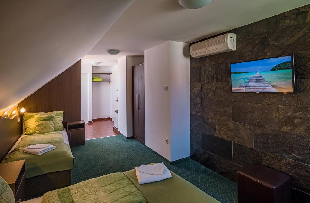 Postel nebo postele na pokoji v ubytování Babi Guesthouse - Babi Vendégház