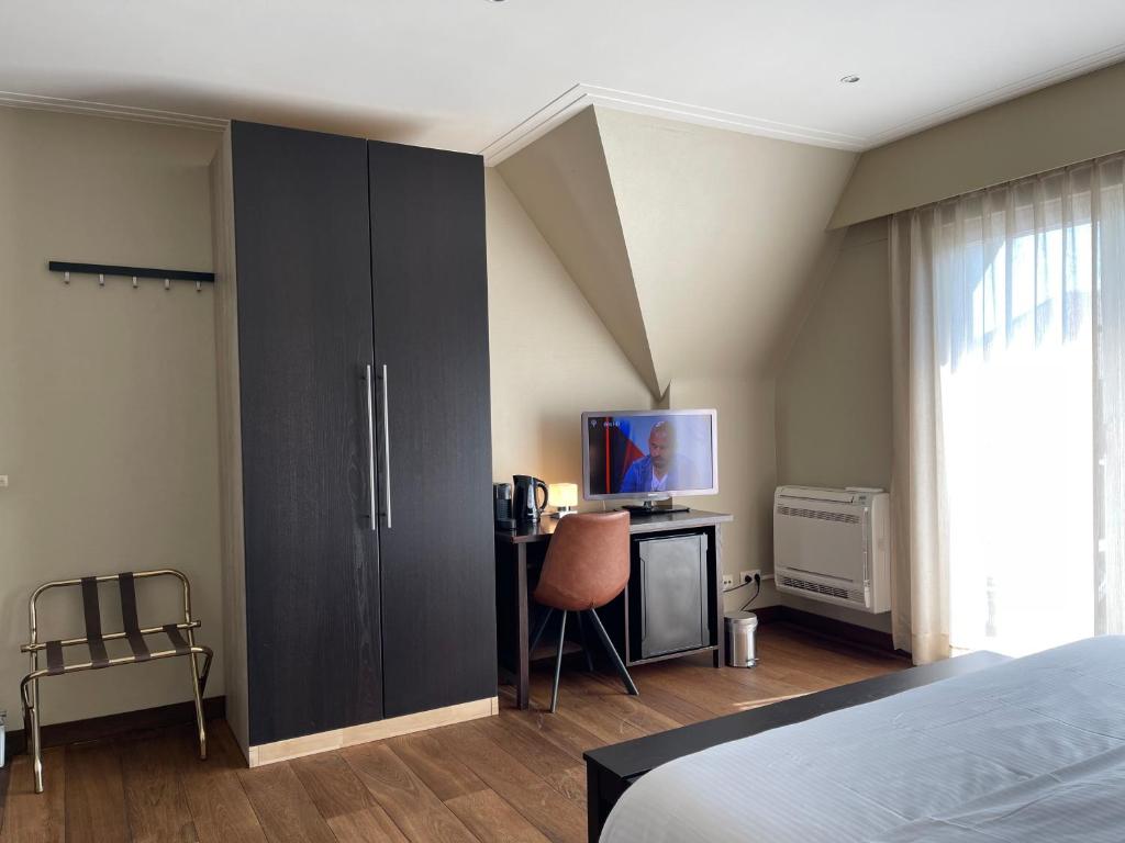 Postel nebo postele na pokoji v ubytování Villa Hotel