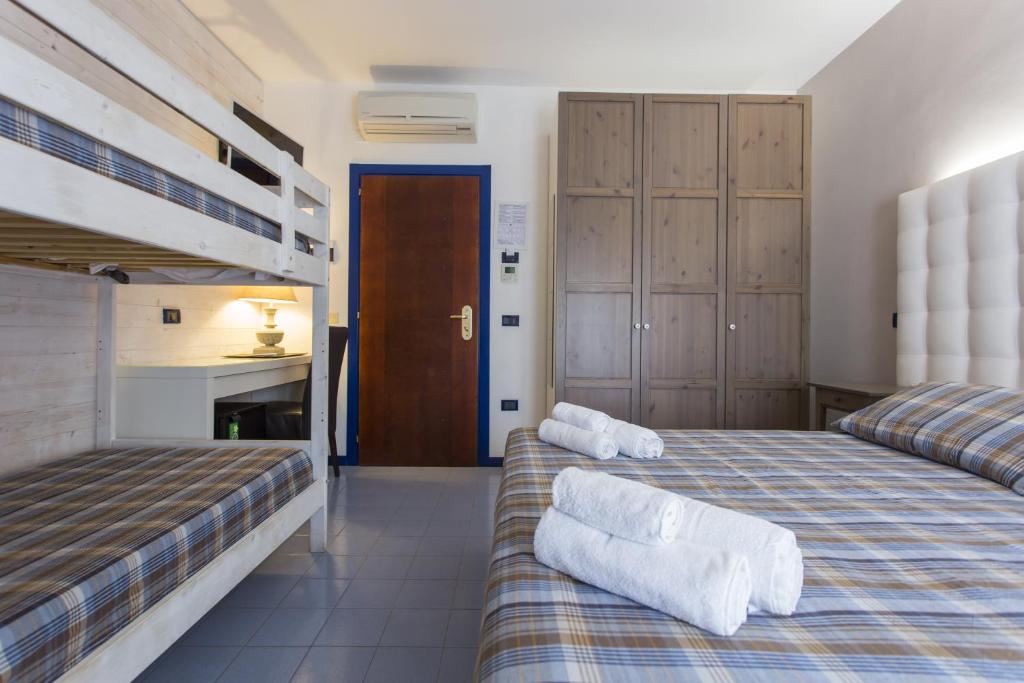 Postel nebo postele na pokoji v ubytování Hotel Alba