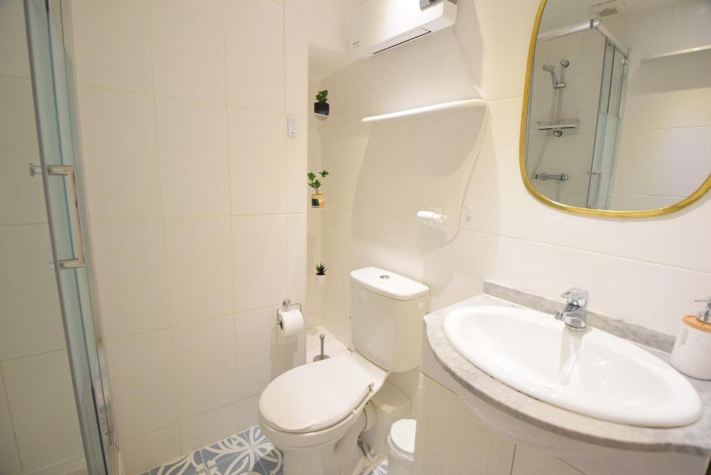 a bathroom with a toilet and a sink and a mirror at Nice Renting - BARILLERIE - COZY LOFT OLD NICE - SEA FRONT - SALEYA - MASSENA in Nice
