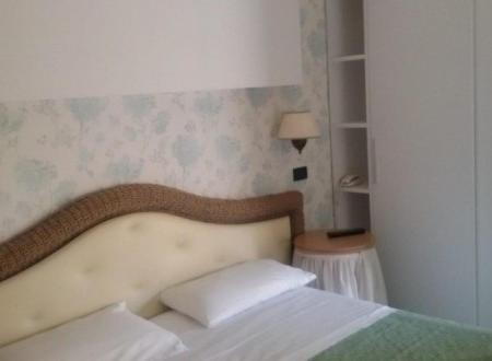 Postel nebo postele na pokoji v ubytování Hotel Alba