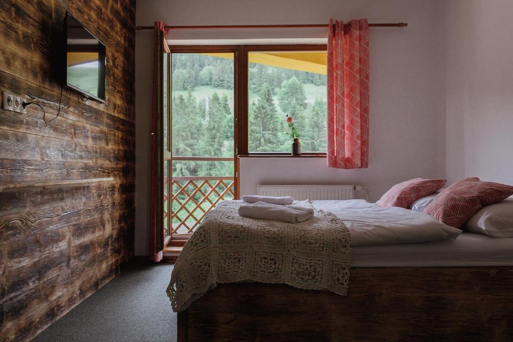Postel nebo postele na pokoji v ubytování Penzión Salamander