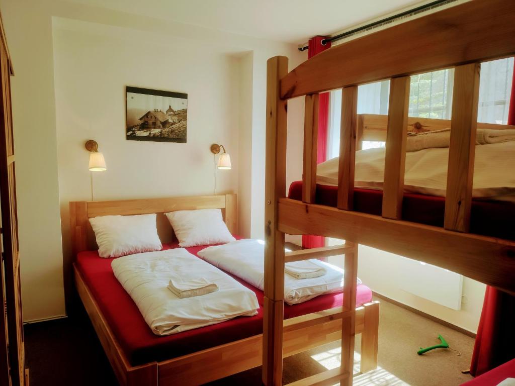 Postel nebo postele na pokoji v ubytování Apartmánový Dům Pasťák
