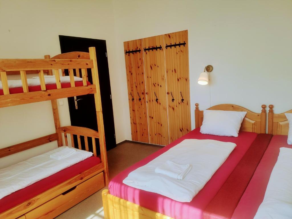 Postel nebo postele na pokoji v ubytování Apartmánový Dům Pasťák
