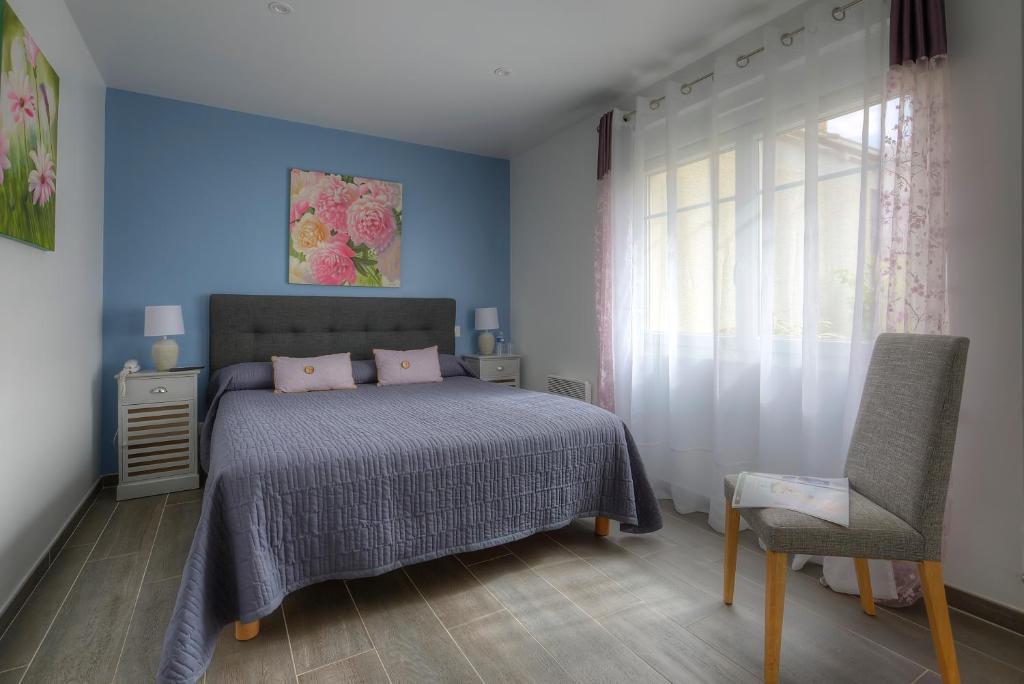 Postel nebo postele na pokoji v ubytování Hôtel Le Nautile