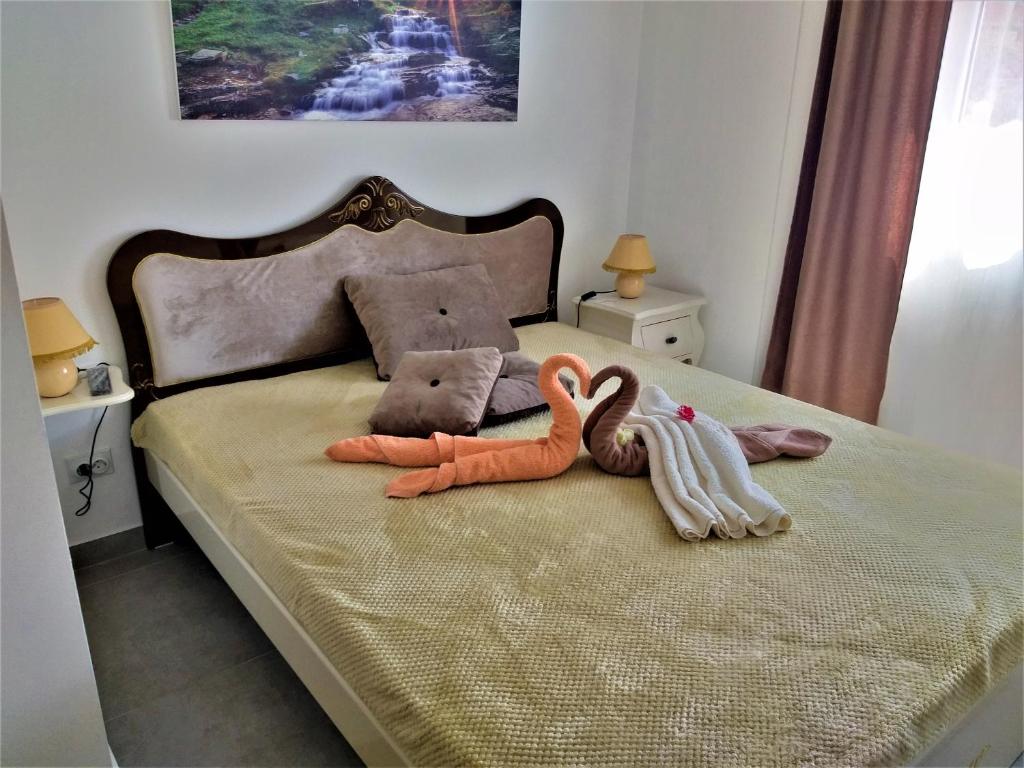 Una cama o camas en una habitación de Apartmani Soko Day 1