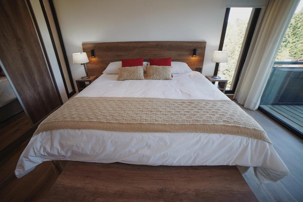 Postel nebo postele na pokoji v ubytování AWKA Apart Hotel