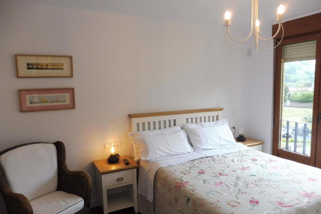 Postel nebo postele na pokoji v ubytování Casa Santolaya