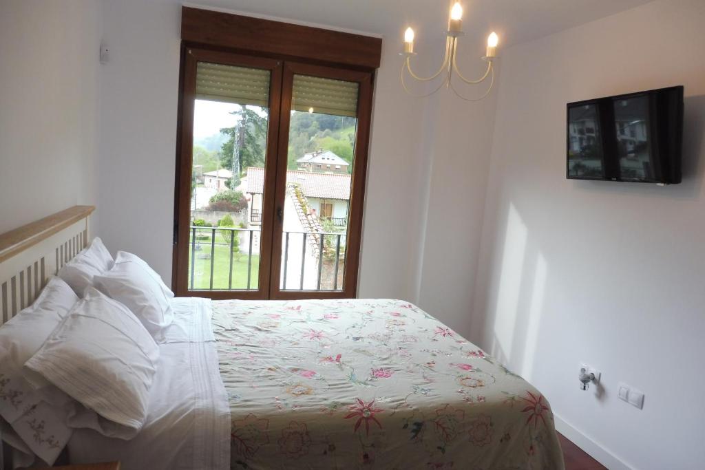 Postel nebo postele na pokoji v ubytování Casa Santolaya