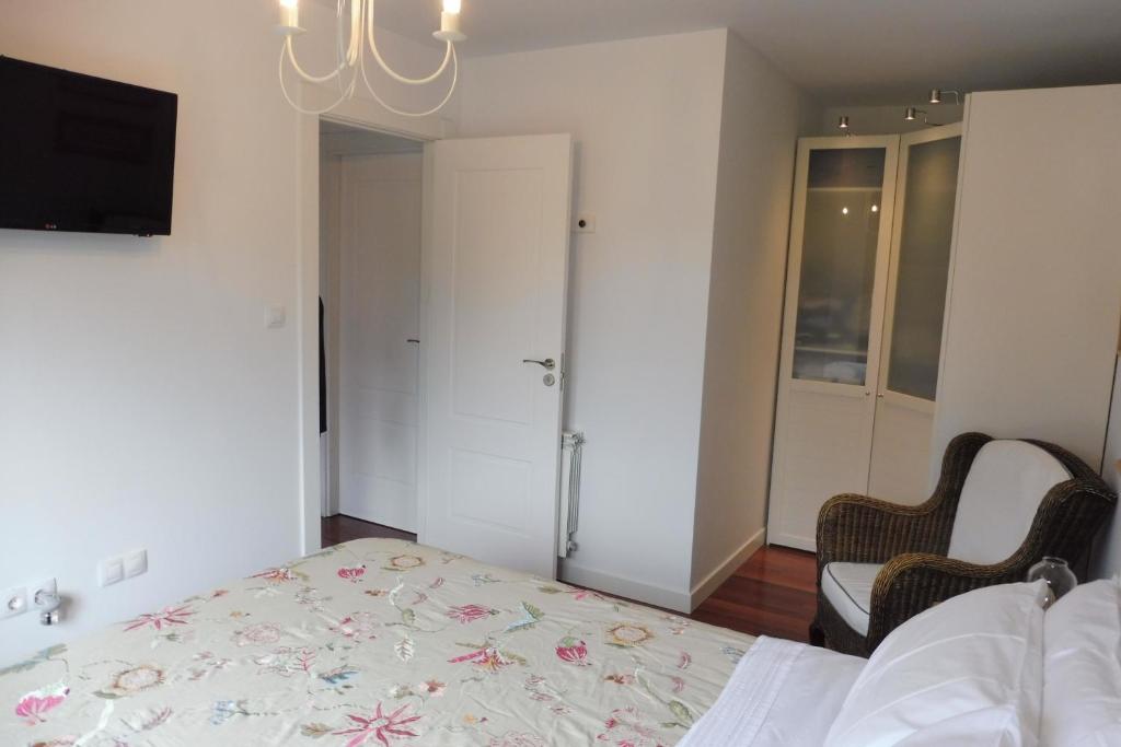 Postel nebo postele na pokoji v ubytování Casa Santolaya