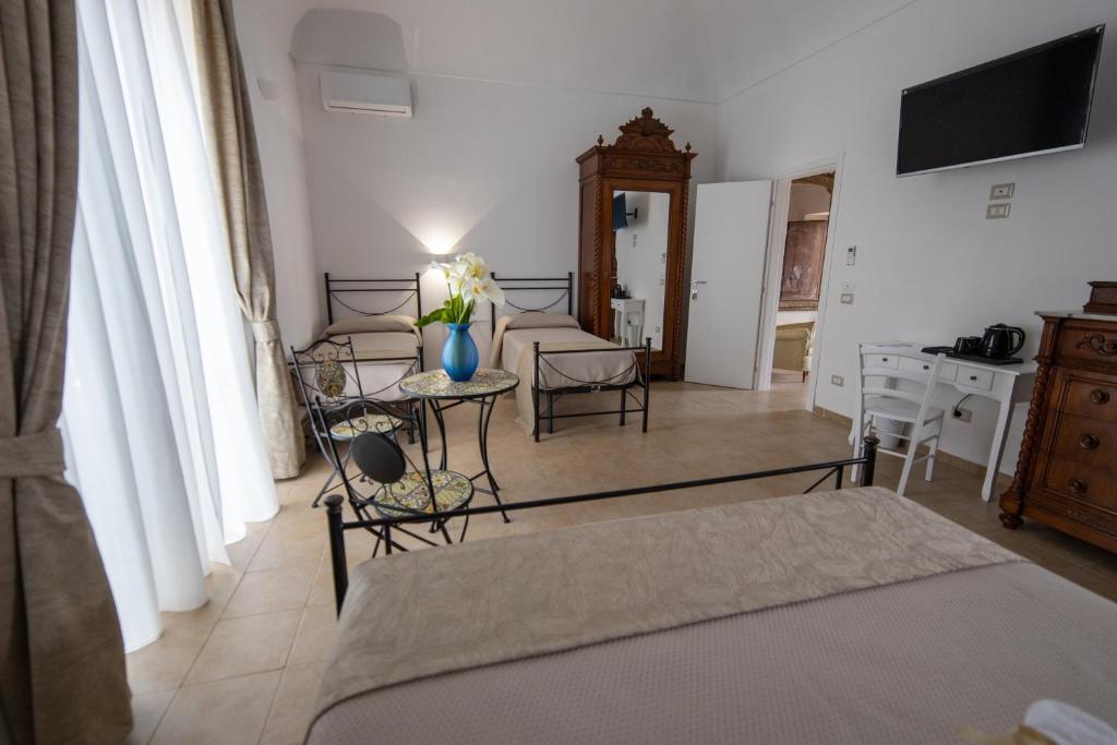 TV a/nebo společenská místnost v ubytování B&B Palazzo Loreto
