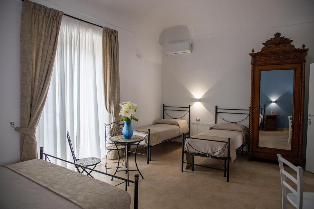 Postel nebo postele na pokoji v ubytování B&B Palazzo Loreto
