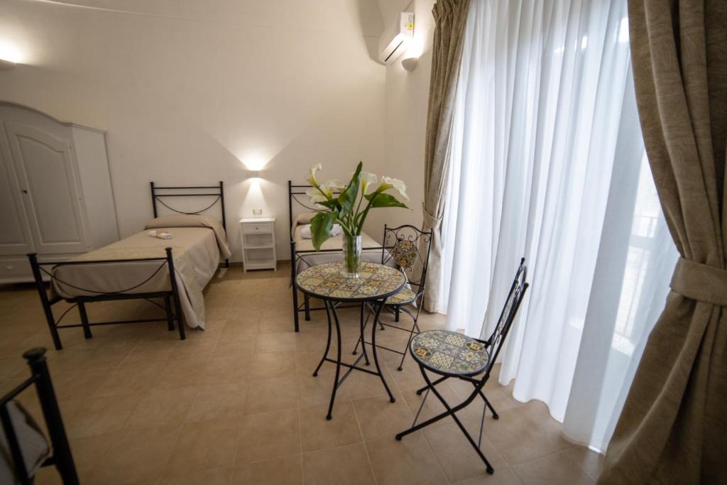 Postel nebo postele na pokoji v ubytování B&B Palazzo Loreto