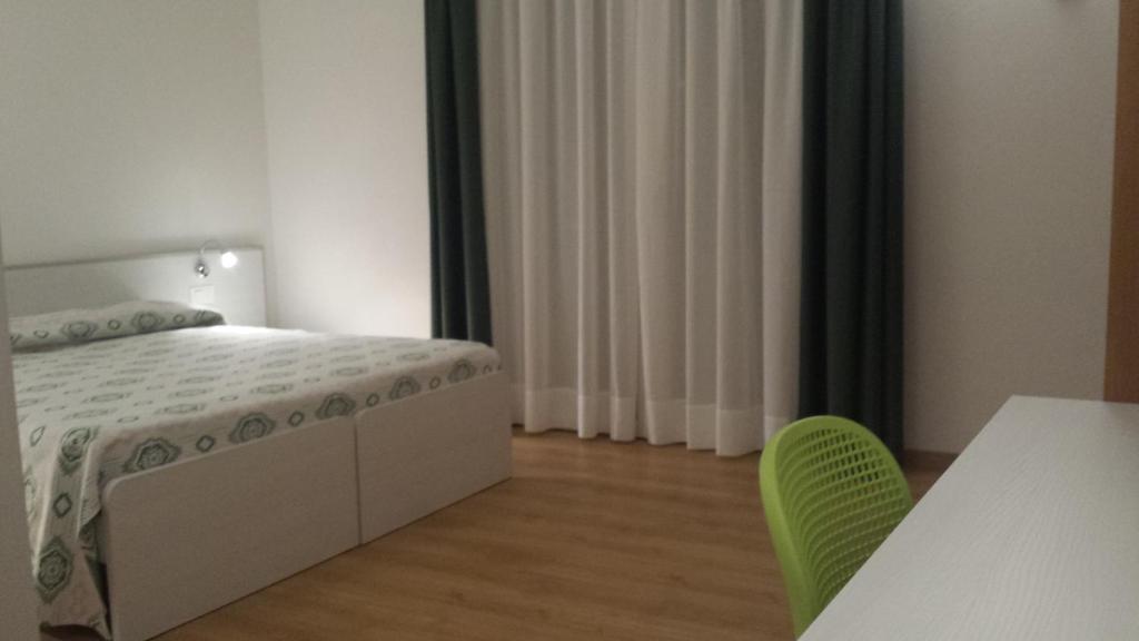 Postel nebo postele na pokoji v ubytování Hotel Rado