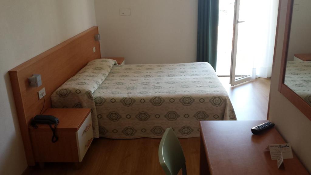Postel nebo postele na pokoji v ubytování Hotel Rado