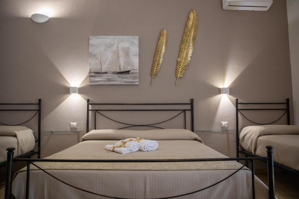Postel nebo postele na pokoji v ubytování B&B Palazzo Loreto