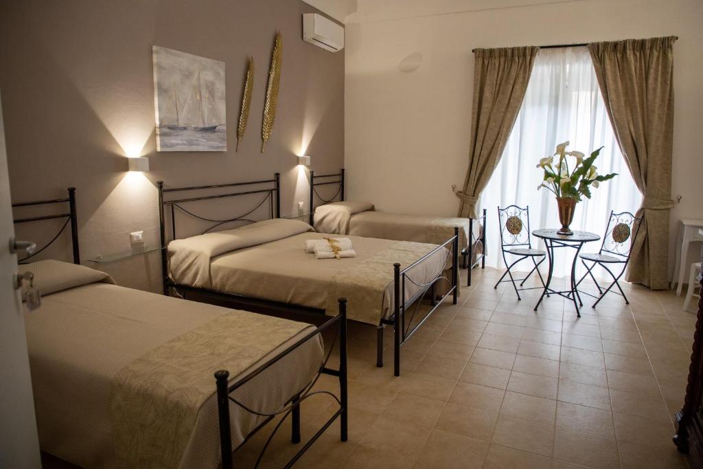 Postel nebo postele na pokoji v ubytování B&B Palazzo Loreto