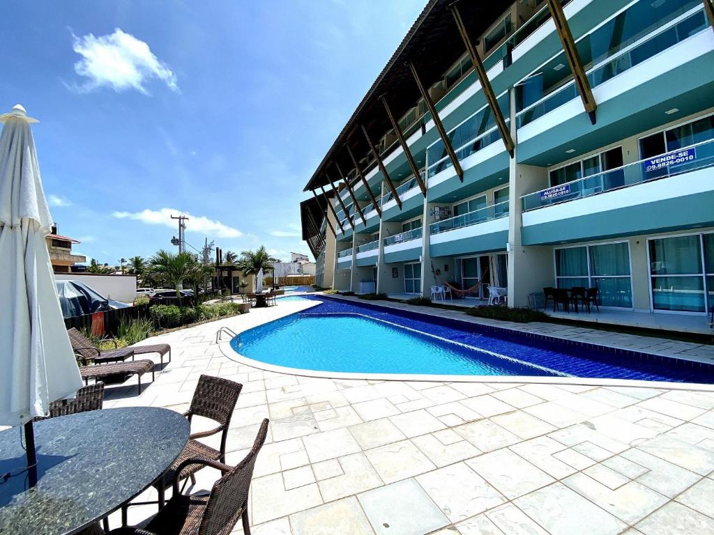  Apto no Villas do Atlântico com vista piscina próximo ao mar por Carpediem