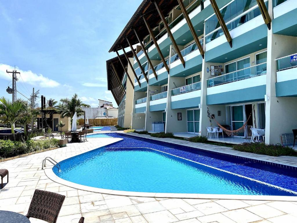 Apto no Villas do Atlântico com vista piscina próximo ao mar por Carpediem