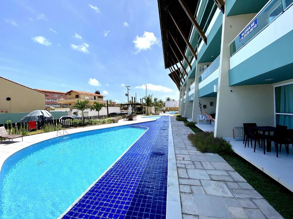  Apto no Villas do Atlântico com vista piscina próximo ao mar por Carpediem