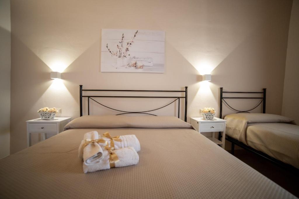 Postel nebo postele na pokoji v ubytování B&B Palazzo Loreto